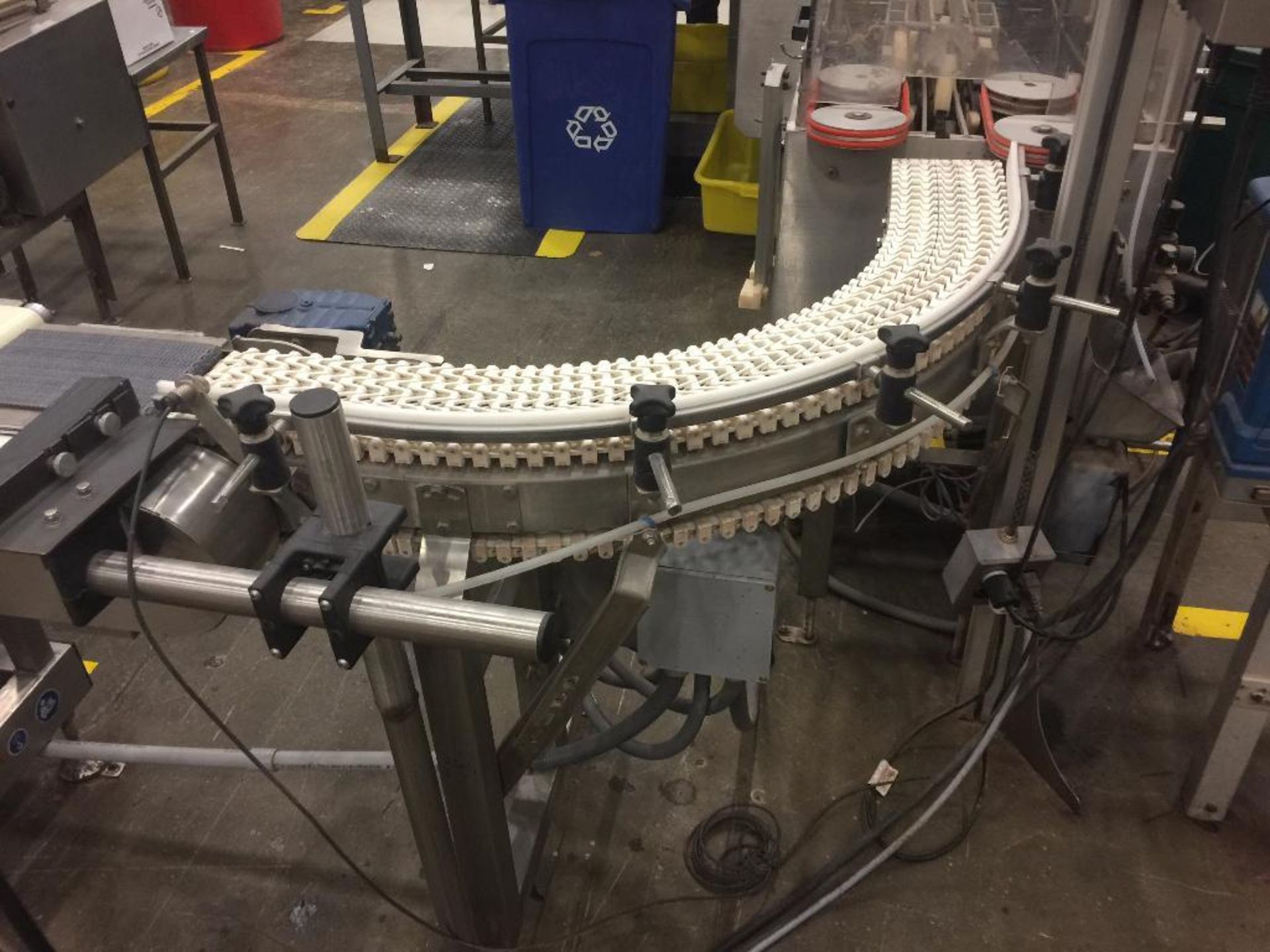 Spantech SS conveyor, 90 degree left, 48 in. x 6 in. white plastic chain belt, motor and variable sp