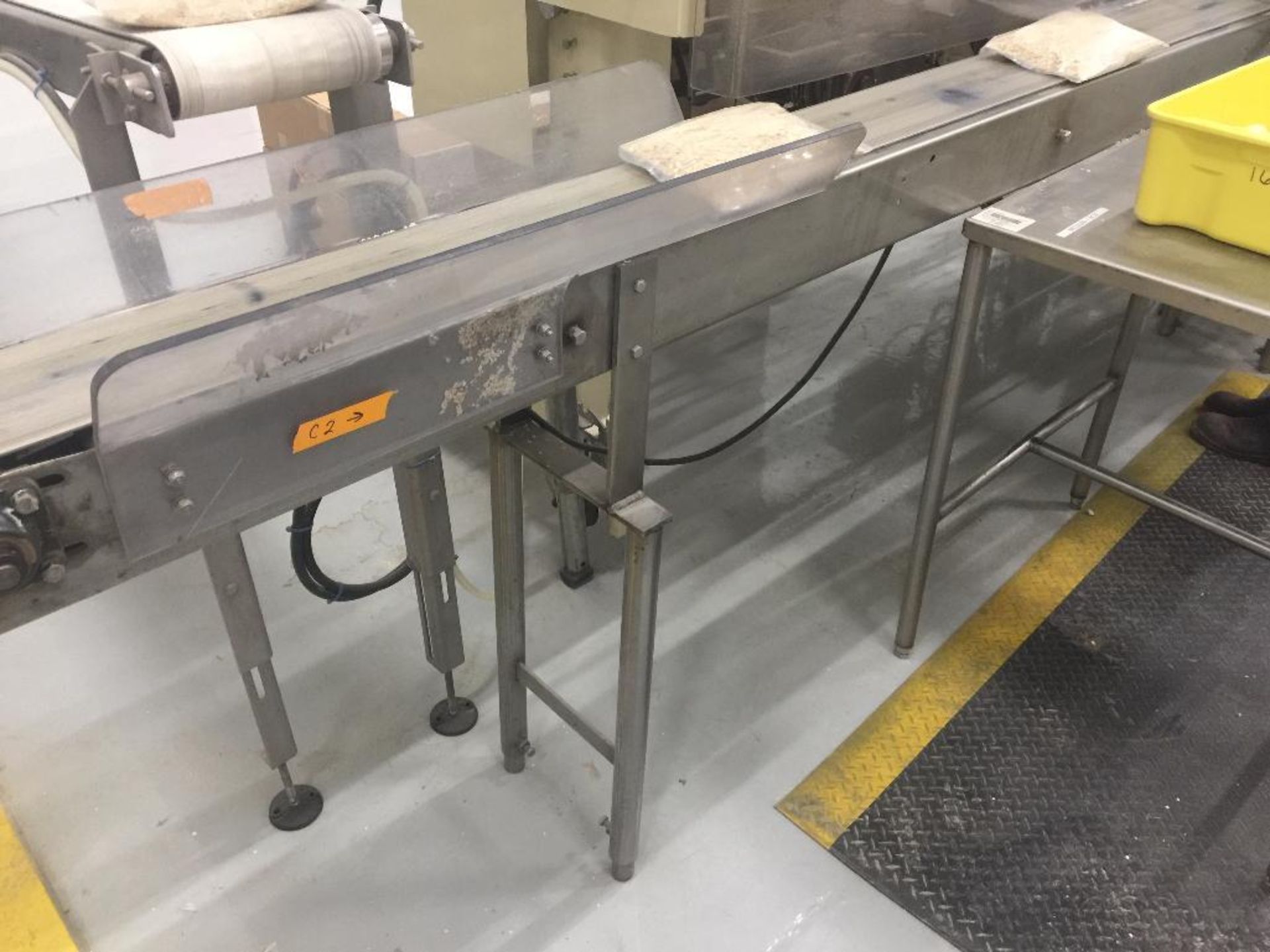 SS conveyor, 96 in. x 7 in., white rubber belt, motor and drive. (to hand pack) (FPC87) - ** Located