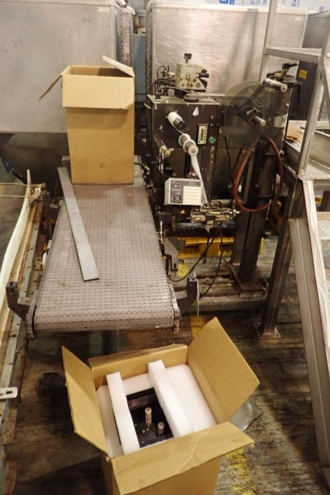 CTM labeler with feed conveyor, mounted on mild steel frame on wheels, with (2) Sato printers, Model