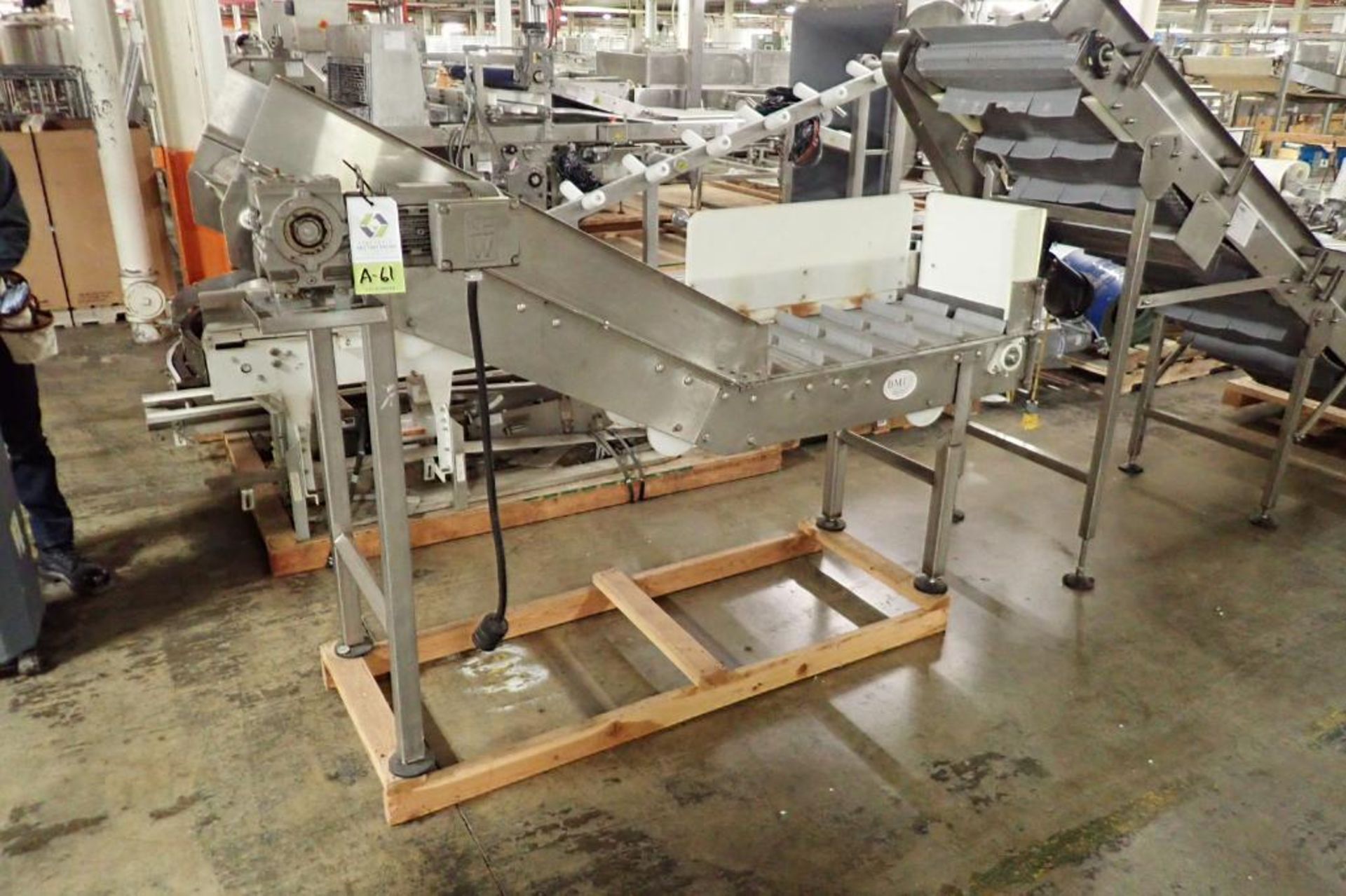 BMI flighted incline conveyor {Located in Indianapolis, IN}