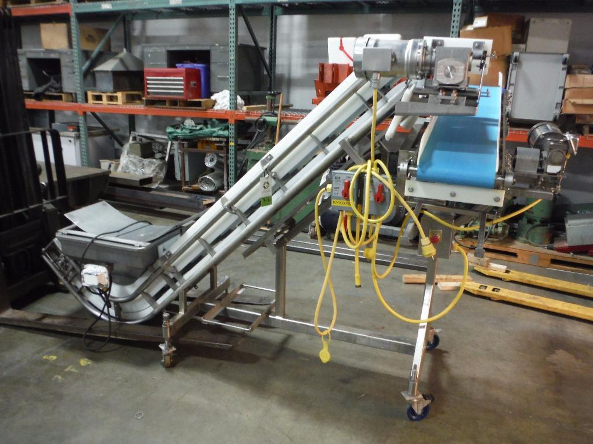 Incline conveyor {Located in Florence, KY}