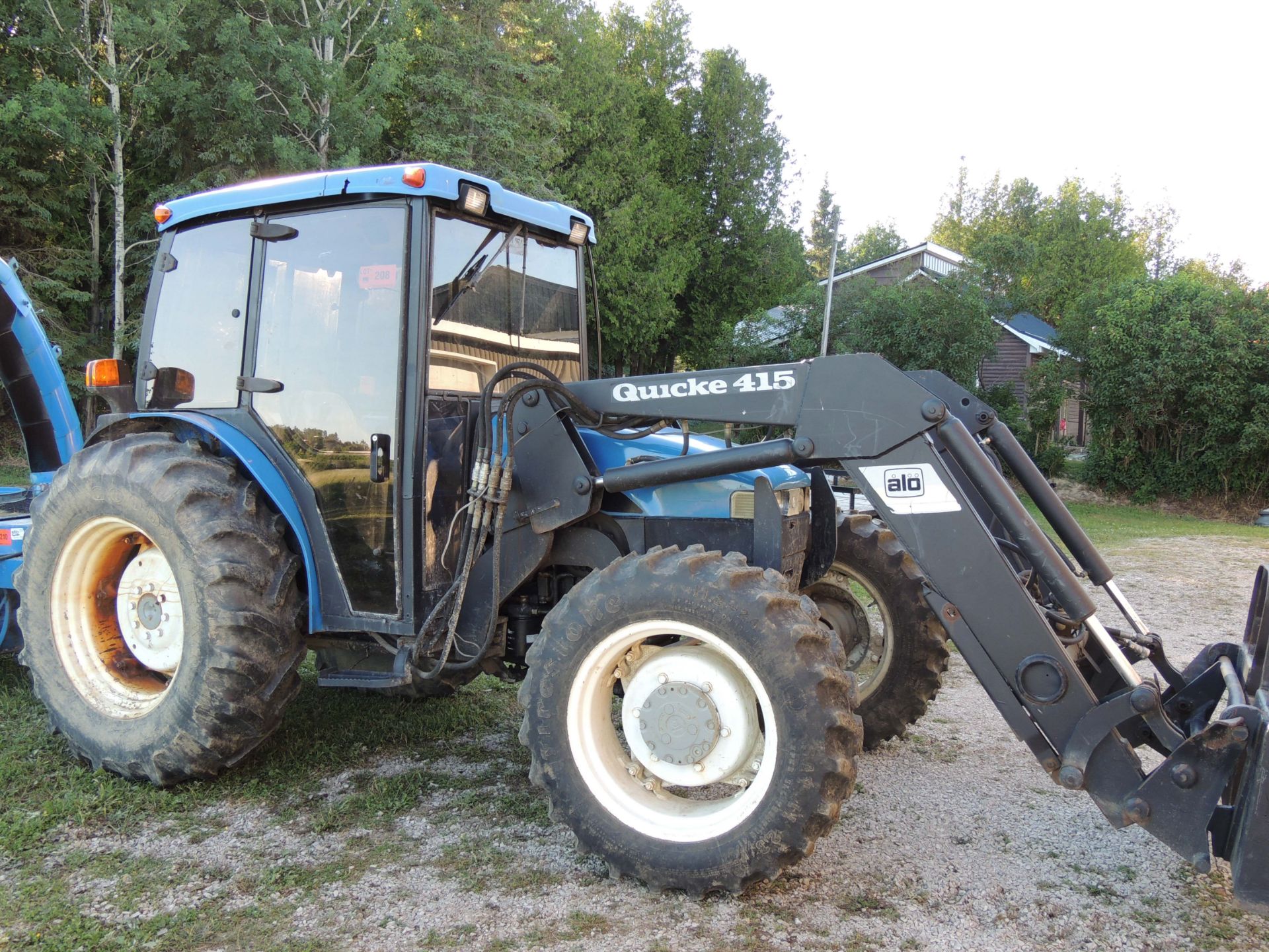 NEW HOLLAND TN75S DIESEL TRACTOR WITH IVECO 2.9L 3 CYLINDER ENGINE, 16.9-30 REAR TIRES, ENCLOSED