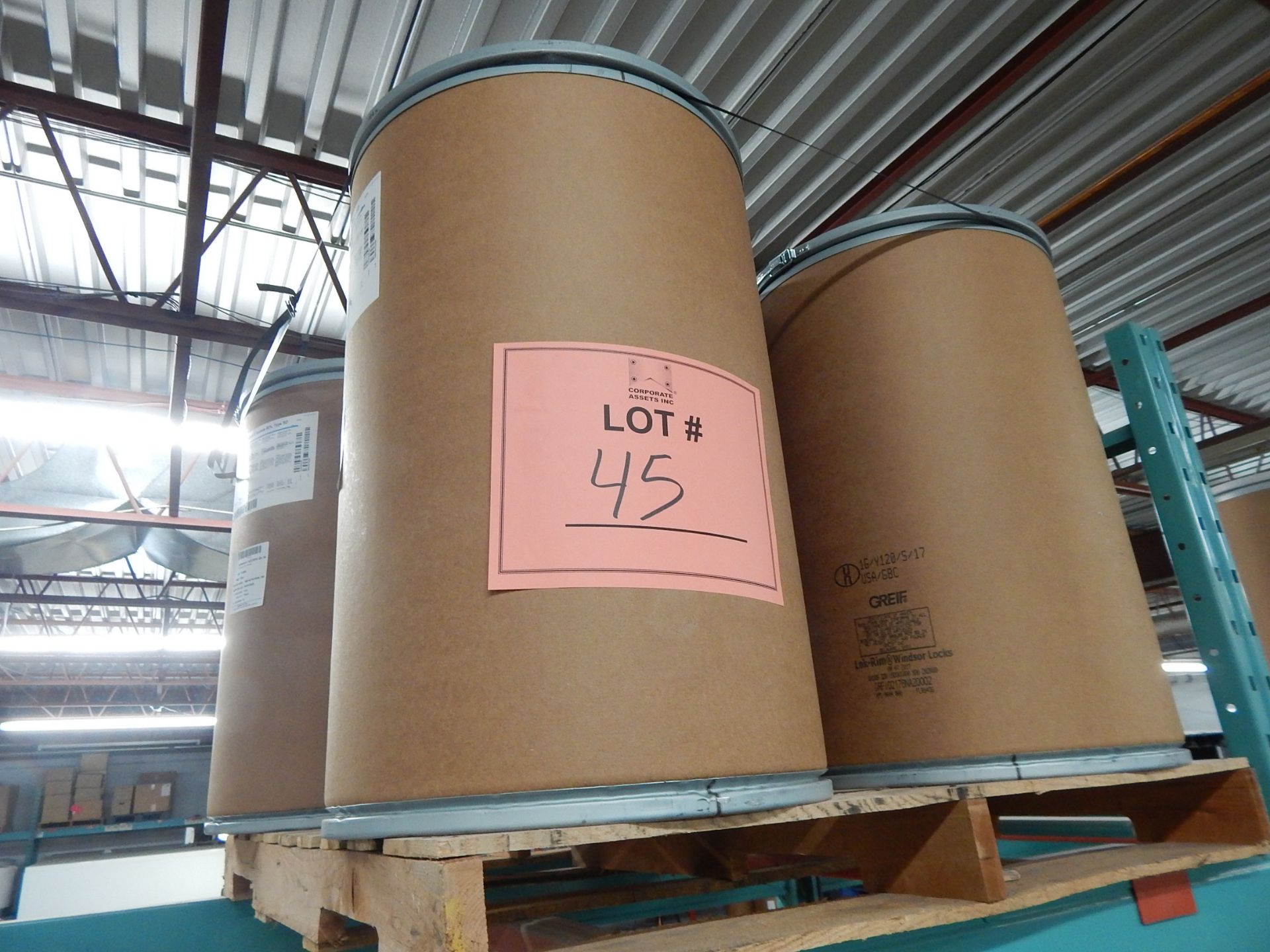 LOT/ SKID WITH CONTENTS CONSISTING OF DRUMS OF VITAMIN E ACETATE