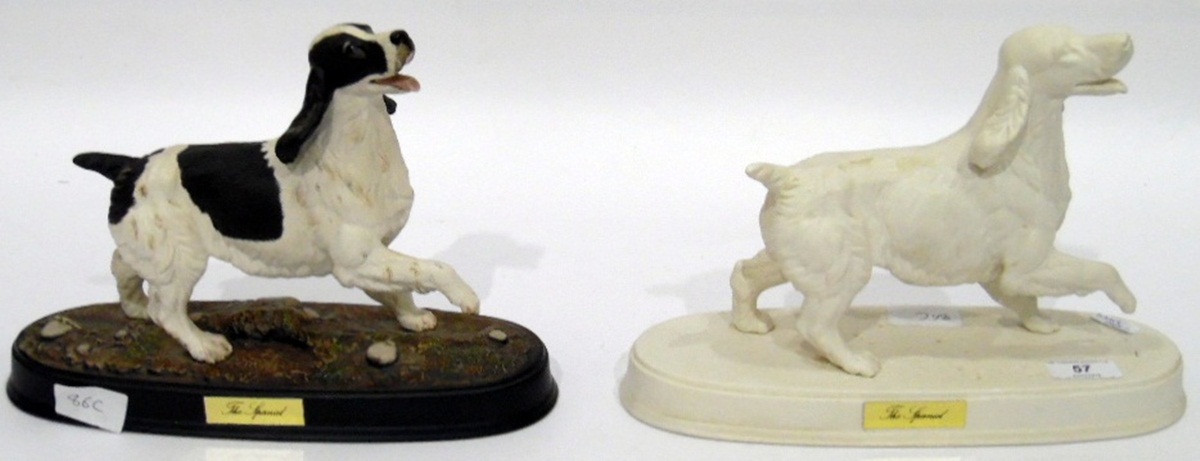 Two Beswick 'The Spaniel' in white bisque and tinted bisque,