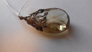 Art Nouveau silver pendant set single pear-shaped facet-cut citrine and having ivy-leaf mount