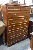 Stag chest of two short and five long drawers,