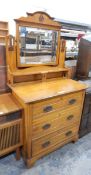 Edwardian walnut dressing chest fitted with swing toilet mirror, the mirror with pierced decoration,