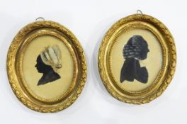 Pair of late 18th/early 19th century silhouette paintings heightened in white,