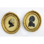 Pair of late 18th/early 19th century silhouette paintings heightened in white,