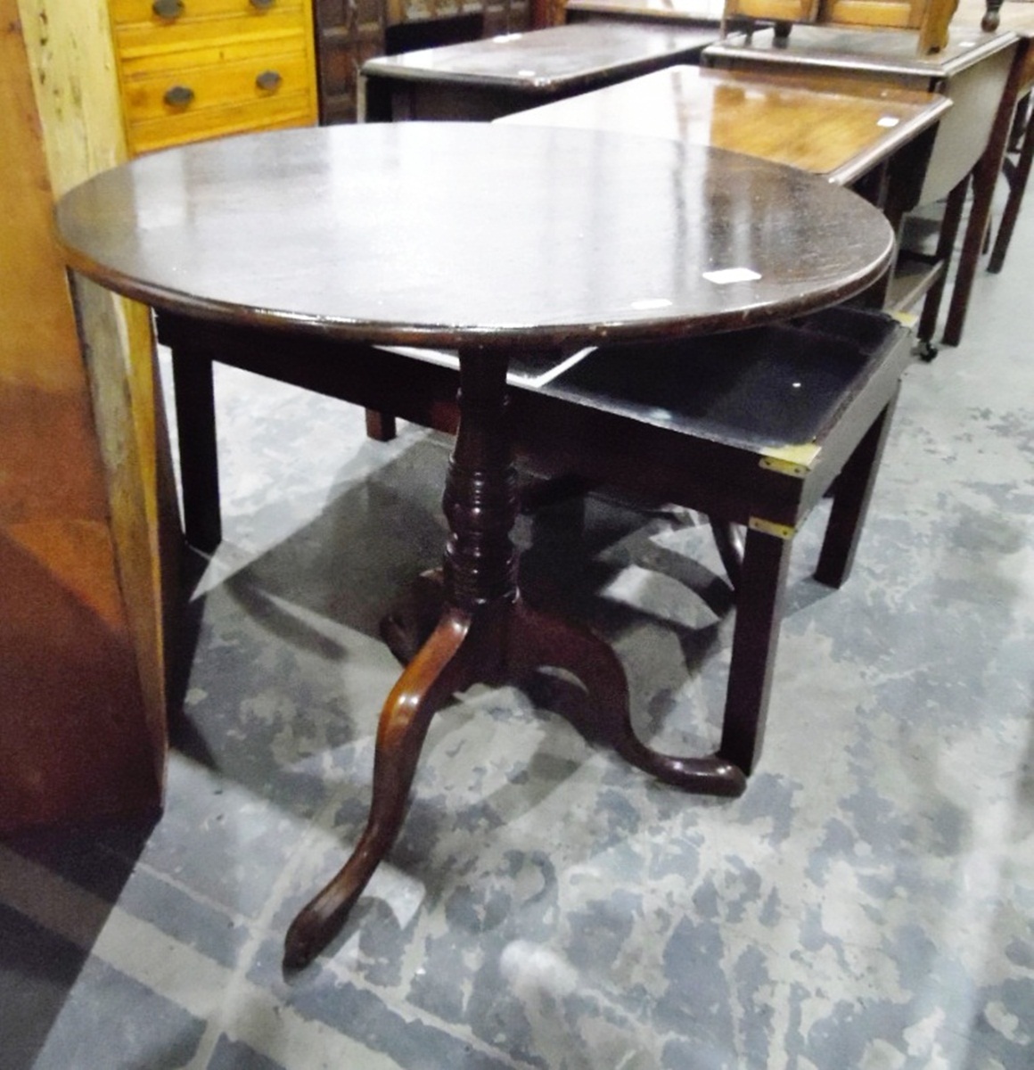 19th century oak tripod table with circular top and turned stem,
