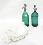 Two soda syphons, green glass, one marked Budapest to metal top,