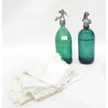 Two soda syphons, green glass, one marked Budapest to metal top,