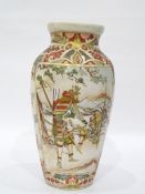 Japanese pottery Satsuma vase decorated with panels of Japanese male figures on a veranda,