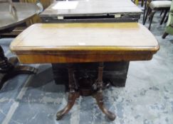 19th century walnut folding games table over profusely turned supports with four carved splayed