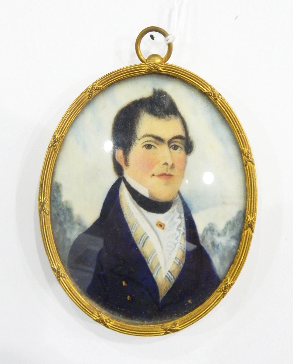Early 19th century portrait miniature on ivory of a gentleman with dark hair wearing a blue coat, 7.