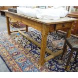 19th century fruitwood kitchen table of rectangular form, fitted with a single drawer to either end,