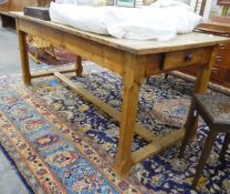 19th century fruitwood kitchen table of rectangular form, fitted with a single drawer to either end,