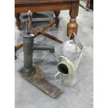 Metal pump on a wooden base and two metal watering cans (3)