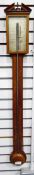 19th century mahogany stick barometer, the case with broken arch pediment,