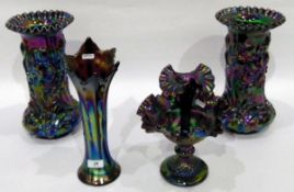 Pair of iridescent carnival glass vases with crimped rims, the bodies decorated with irises,