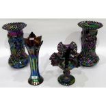 Pair of iridescent carnival glass vases with crimped rims, the bodies decorated with irises,