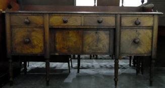 Early 19th century mahogany sideboard fitted with one long and two short drawers over cupboards,