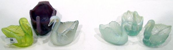 Six pressed glass models of swans including a purple example