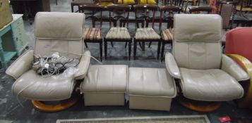 Pair of Ekornes Stressless leather upholstered modern swivel reclining armchairs on bentwood