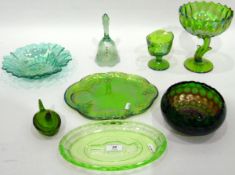 Quantity of green pressed glass and green carnival glass including an oval dish decorated with