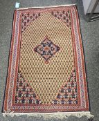 Iranian Kelim with central floral midnight blue lozenge, on a beige ground, with geometric motifs,