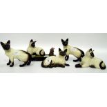 Beswick model Siamese cat with mouse and four other Siamese cats