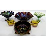 Large carnival glass punch bowl and cups decorated with fruiting vines,