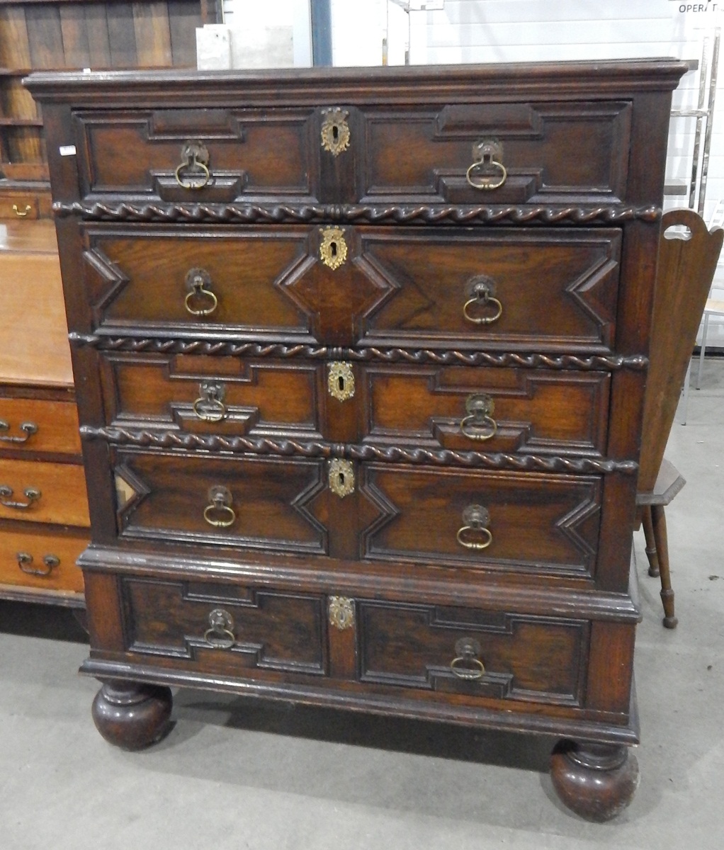 Oak chest of four long and two short drawers, in the 17th century style,