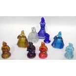 Quantity of carnival glass ornaments including four figures of seated girls in different colours,
