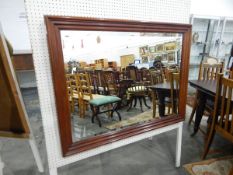 Modern mahogany framed mirror with rectangular stepped frame, the mirror with bevelled edge,