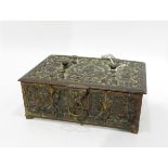 Early 20th century brass lidded jewellery box, the hinged lid with floral relief decoration,
