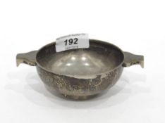 Scottish silver quaich, circular with pear-shaped tab handles, 12cm wide overall,