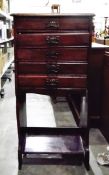 Mahogany sheet music cabinet fitted with five drawers and open shelf,