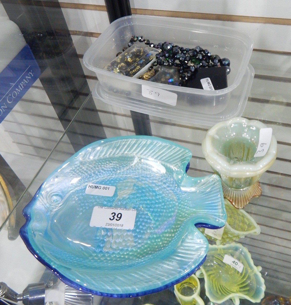 Two modern glass dishes modelled as fish, one in blue and one in turquoise,