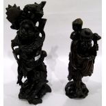 Chinese carved hardwood figure of a man with a chained dog at his feet,