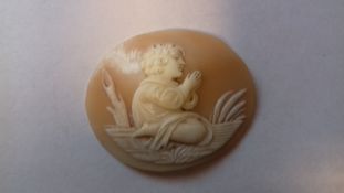 Georgian carved shell cameo, circa 1730-1760 oval, kneeling child, possibly Moses in the bullrushes,