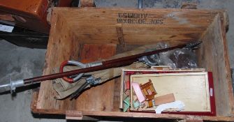 Army camp bed, two shooting sticks, a damaged doll's house with doll's furniture,