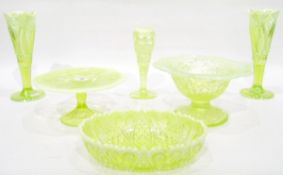 Collection of green pressed glass items with opalescent rims,