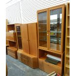 Suite of German Hülsta furniture comprising a glazed two-door cupboard, a display cabinet, shelves,