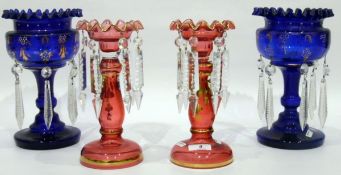 Pair of Victorian blue glass lustres, the central vases with gilt and enamel decoration,