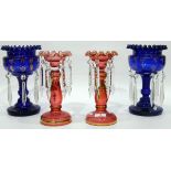 Pair of Victorian blue glass lustres, the central vases with gilt and enamel decoration,