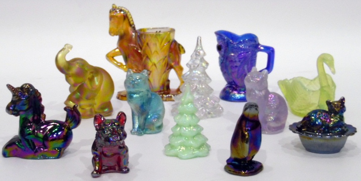 Quantity of carnival glass ornaments including a Boyd carnival glass model of a unicorn and others