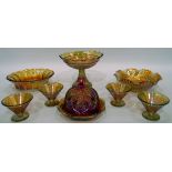 Marigold carnival glass comport, the bowl decorated with roses, on flared stem,