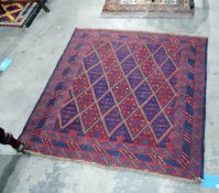 Tribal Kazak wool rug with red and blue lozenge trelliswork to the field, with geometric motifs,