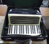 Carmen II accordion made by Hohner within its original leather case